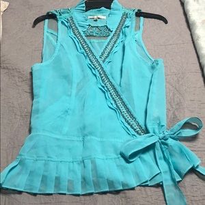 Beautiful wrap turquoise blouse.